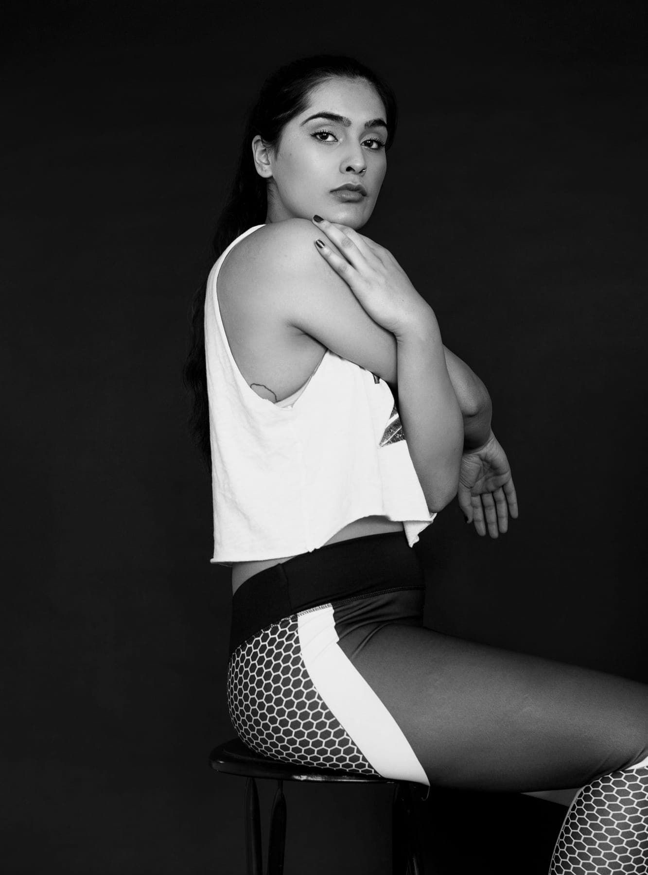 Alumna sentada con ropa deportiva